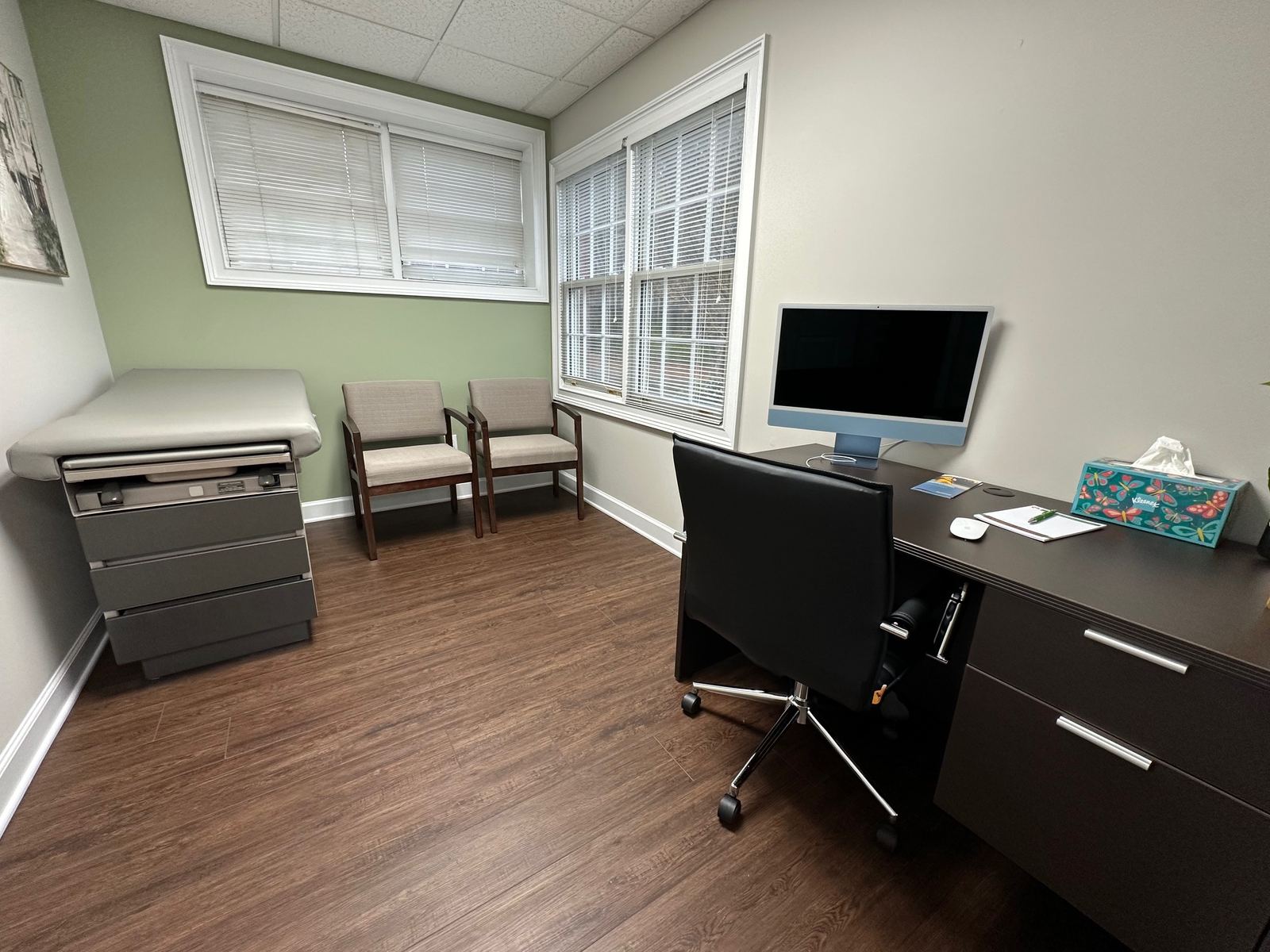 Consult room with seating and a desk at Sun Valley Psychiatry